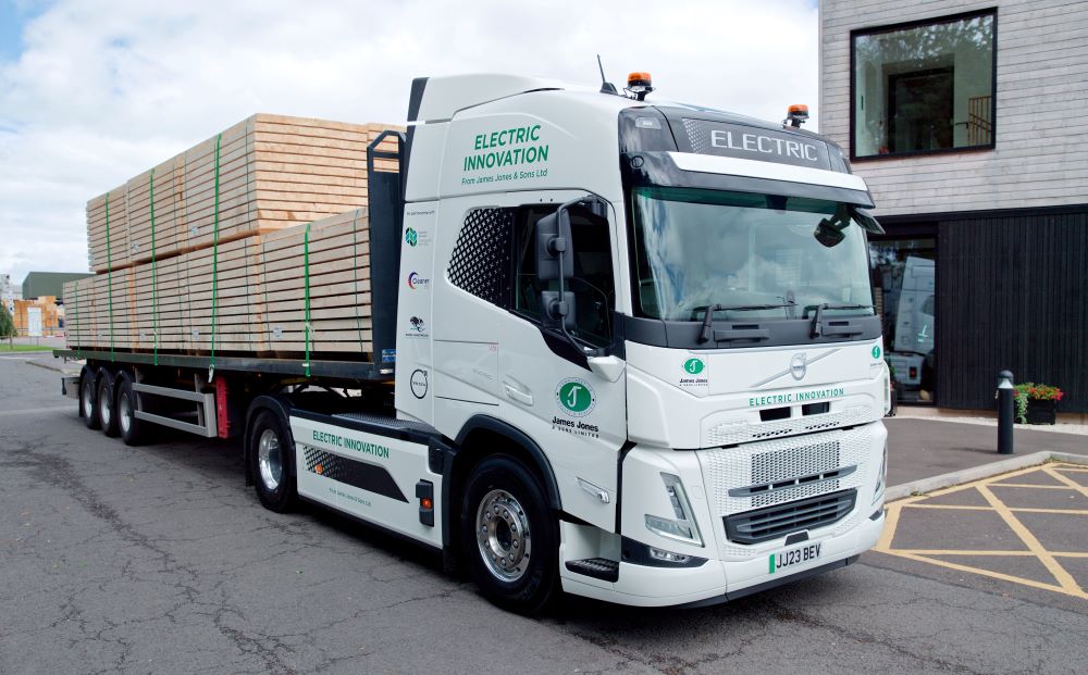 Electric timber lorry in operation